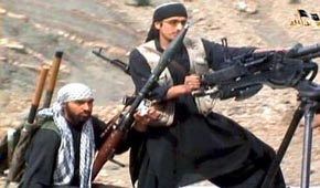 Shahab Dashti, left, in a 2009 militant propaganda video.